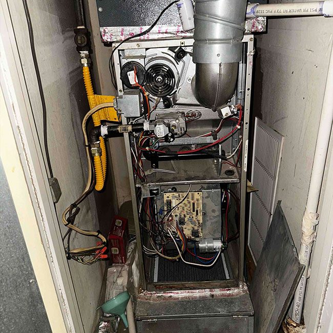 Open gas furnace during a maintenance and safety check in Fort Worth