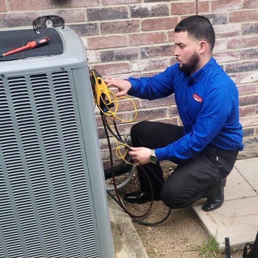 The Right Choice technician testing an air conditioning condenser with gauges